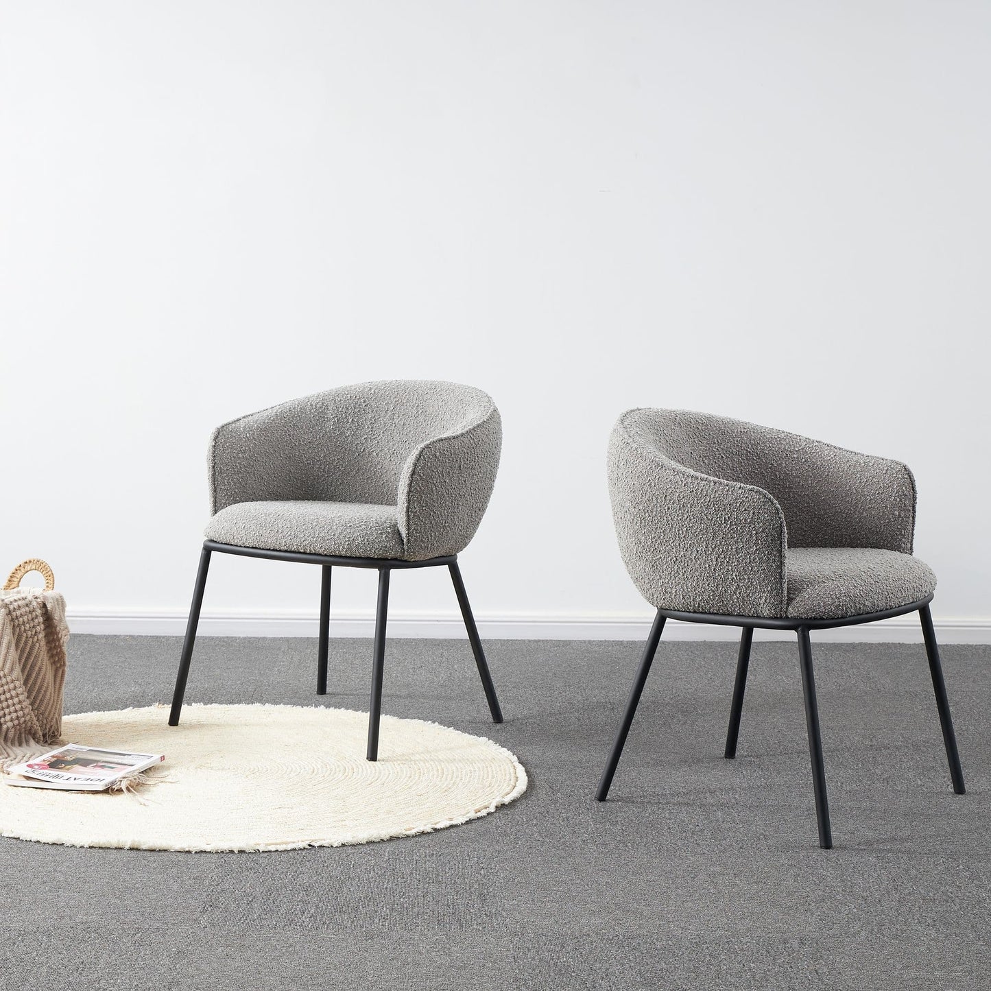 Grey boucle dining chair styled in a minimal modern interior