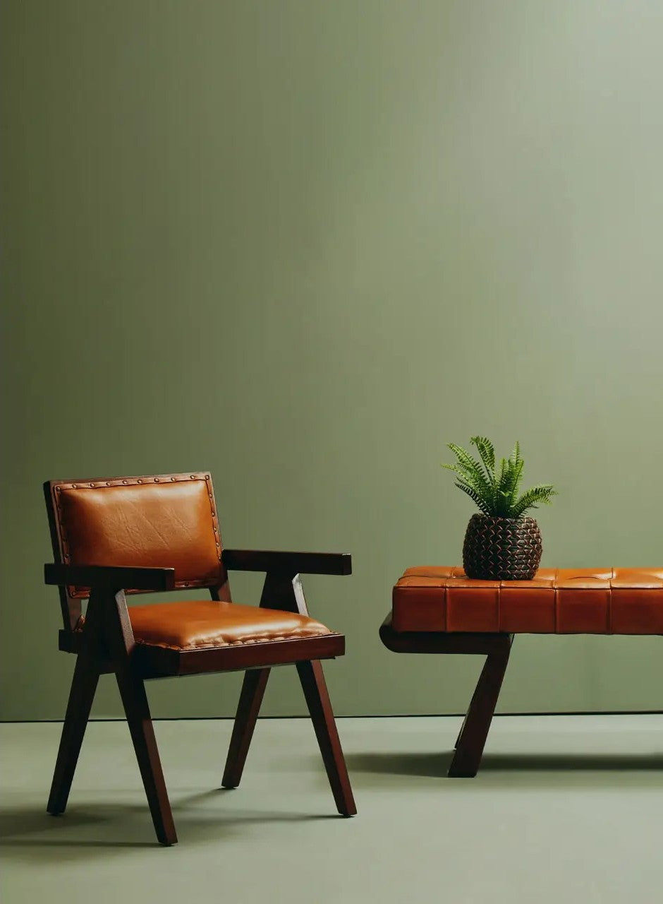 Wooden armchair with leather seat in a warm, modern interior