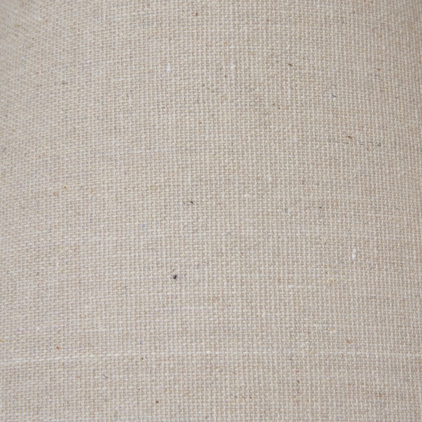 Neutral fabric lampshade with tapered shape, close up of fabric