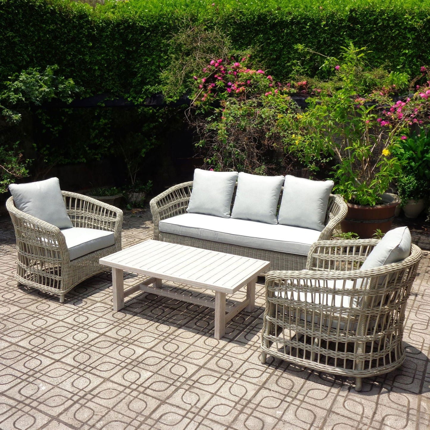Outdoor lounge set with woven frame and cushioned seating
