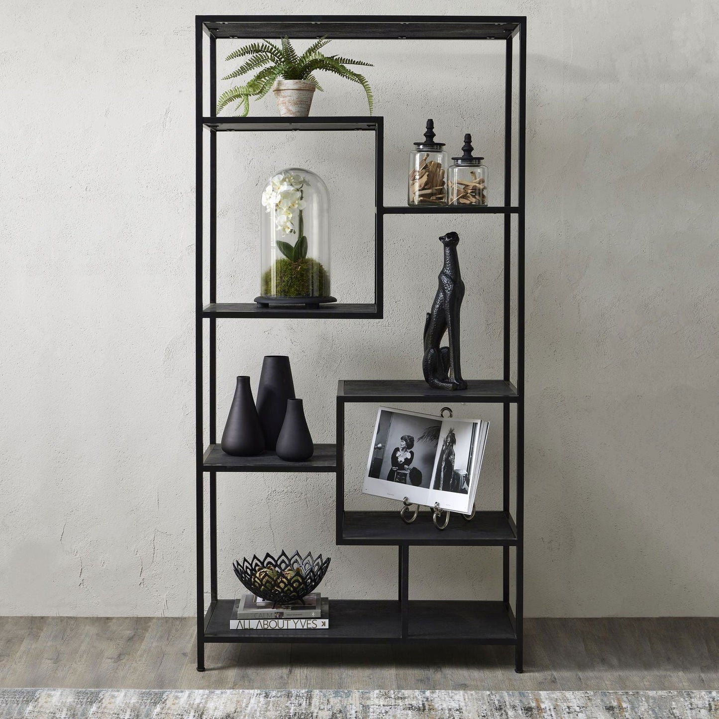 Shelving unit styled in a modern industrial interior setting