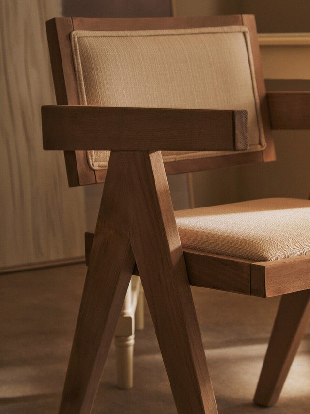 Grey wash beech wood armchair with sculptural armrests, detail