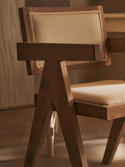Grey wash beech wood armchair with sculptural armrests, detail