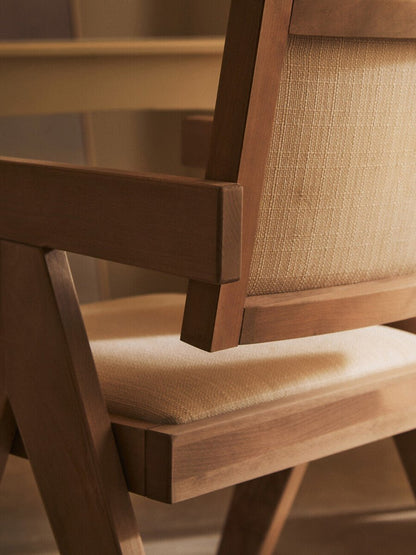 Beech wood armchair in grey wash finish with ivory fabric upholstery, backrest close up detail
