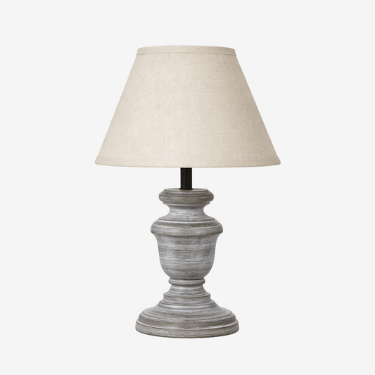 Urn shaped table lamp with light linen shade